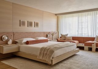 a neutral bedroom with brown and beiges tnes