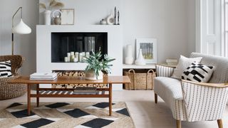 All white living room with white and wooden furniture and natural jute rug