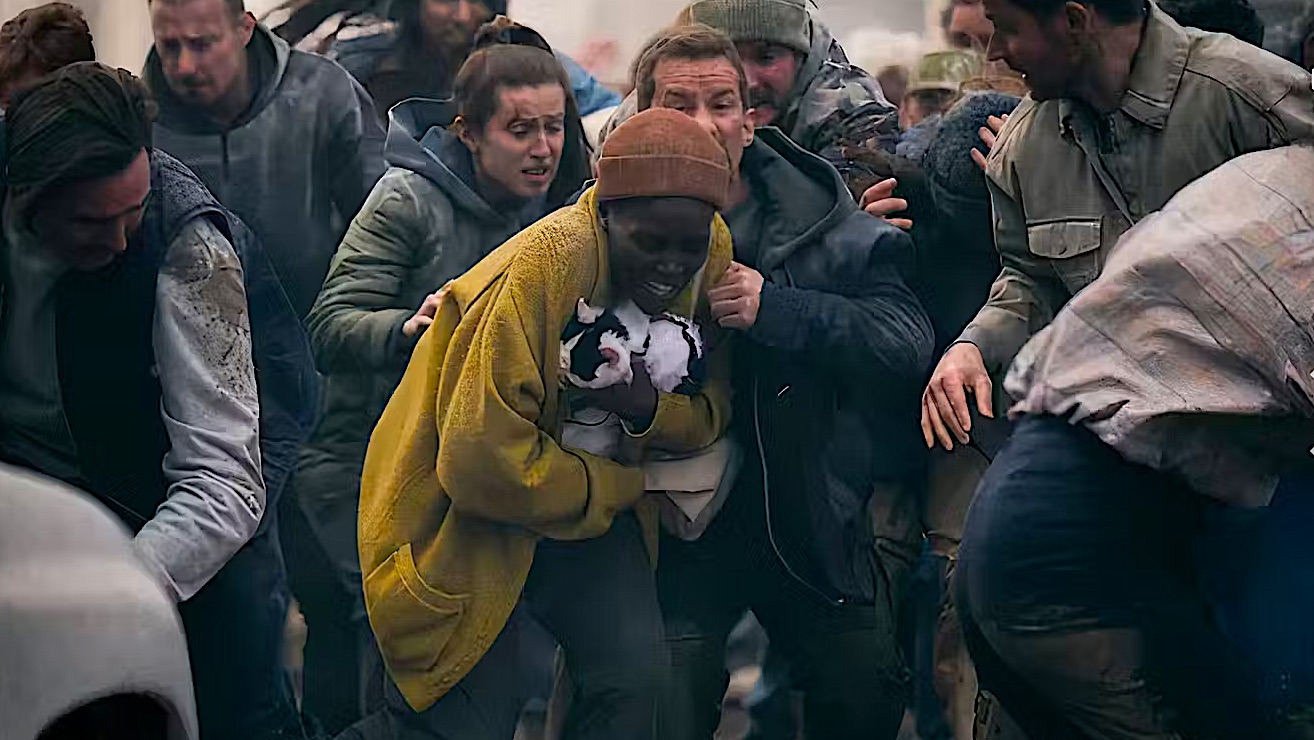 a woman in a panicked crowd holding a cat