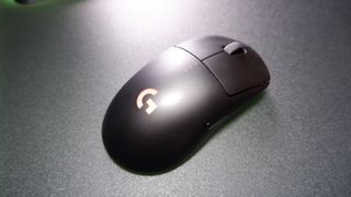 A Logitech G Pro wirless gaming mouse on a mouse pad