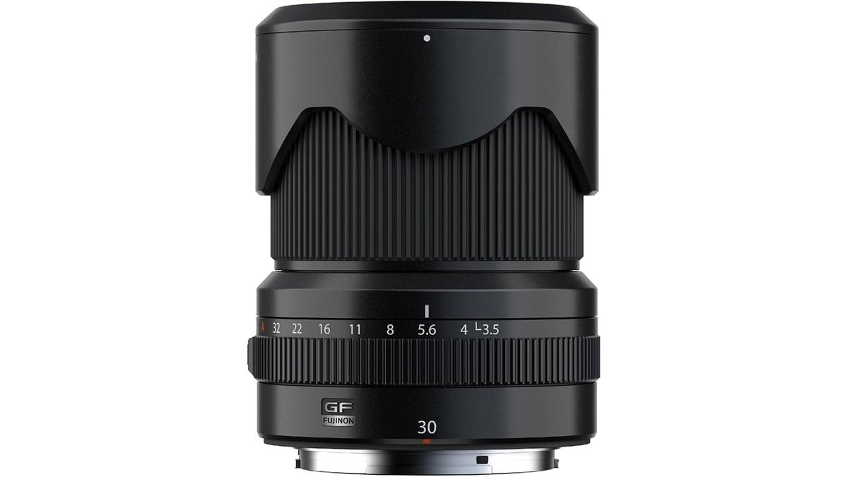 A Fujifilm GF 30mm f/3.5 R WR lens standing upright
