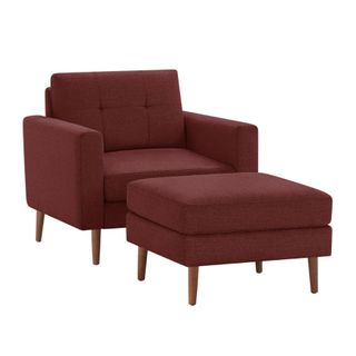 A brick red chair with ottoman