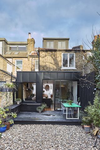 modern black extension to traditional terrace house