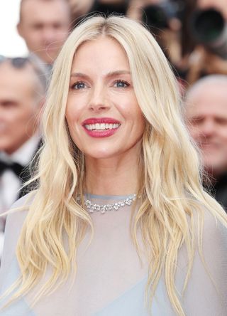 Sienna Miller attends the "Horizon: An American Saga" Red Carpet at the 77th annual Cannes Film Festival at Palais des Festivals on May 19, 2024 in Cannes, France