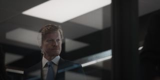 jesse plemons looking through an office conference room window in the series zero day