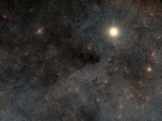 The bright star in this image is Alpha Crucis (aka Acrux), one of the four stars that make up the constellation Crux, The Southern Cross. The upper left of this image is filled with the dust clouds of the Coalsack nebula.