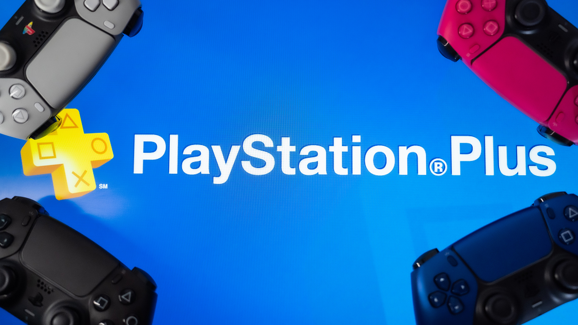 PlayStation Plus logo surrounded by PS5 DualSense controllers