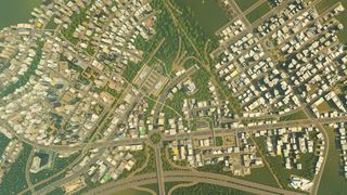 A bird's-eye view of a massive roadway system in the city building game Cities: Skylines.