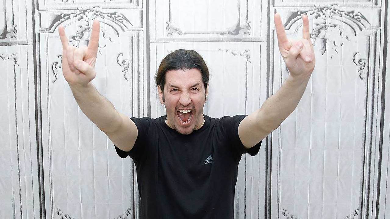 Frank Bello throwing the metal horns