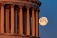 Photo of the full moon behind the pillars US Capitol Dome on February 25, 2024, in Washington, DC.