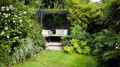 garden area with flower plants and fence