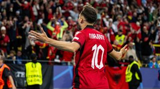 Nedim Bajrami celebrates scoring after 23 seconds for Albania against Italy at Euro 2024.