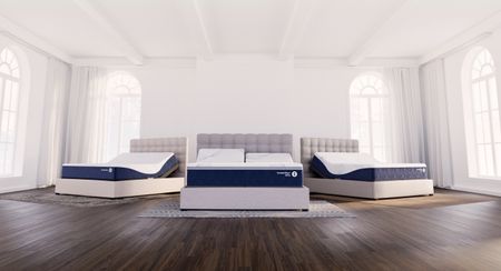 Sleep Number ComfortNext Collection, comprising three beds in an open room with a brown hardwood floor and floor-to-ceiling windows