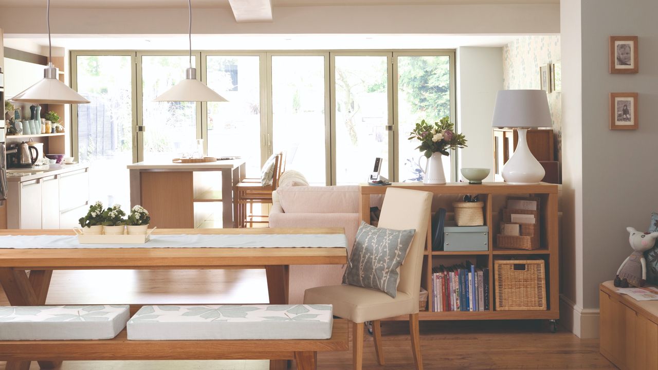 Open-plan kitchen and dining area with pendant lights