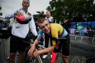 Belgium's Remco Evenepoel celebrates after winning the the men's road cycling individual time trial during the Paris 2024 Olympic Games in Paris on July 27, 2024. (Photo by JEFF PACHOUD / AFP)