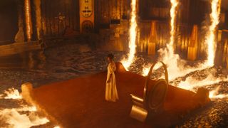Letitia Wright as Shuri, in a burning room, in Black Panther: Wakanda Forever