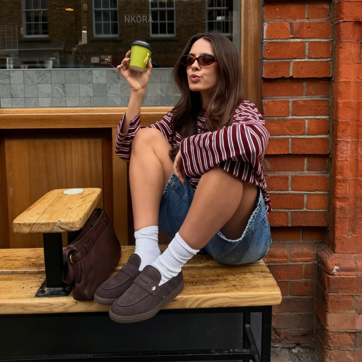 Influencer Tia Dewitt wearing loafers. 