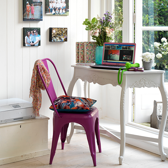 room with wooden flooring and desk with metal chair