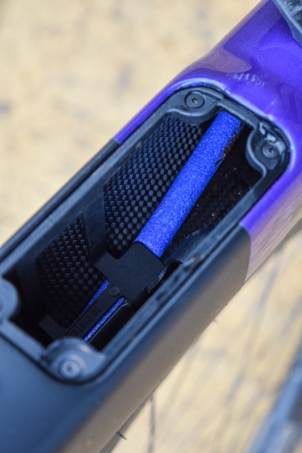 A frame downtube storage compartment