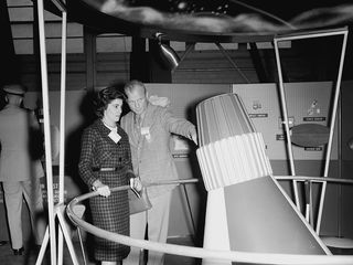 John Glenn explains a feature of the Mercury capsule to his wife, Annie, during one of her visits to NASA Langley in 1959.