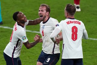 Harry Kane, centre, celebrates after England's 2-1 semi-final victory over Denmark (Mike Egerton/PA).