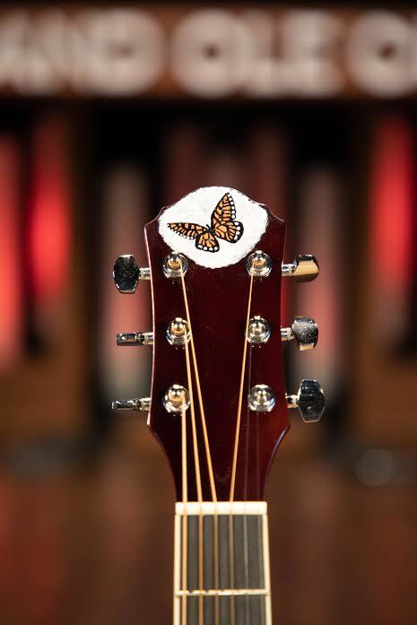 Dolly Parton is auctioning a "9 to 5" Oscar Schmidt guitar