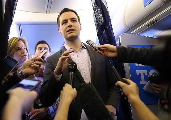 Robby Mook speaks to reporters on Clinton&amp;#039;s campaign plane two weeks before the election.