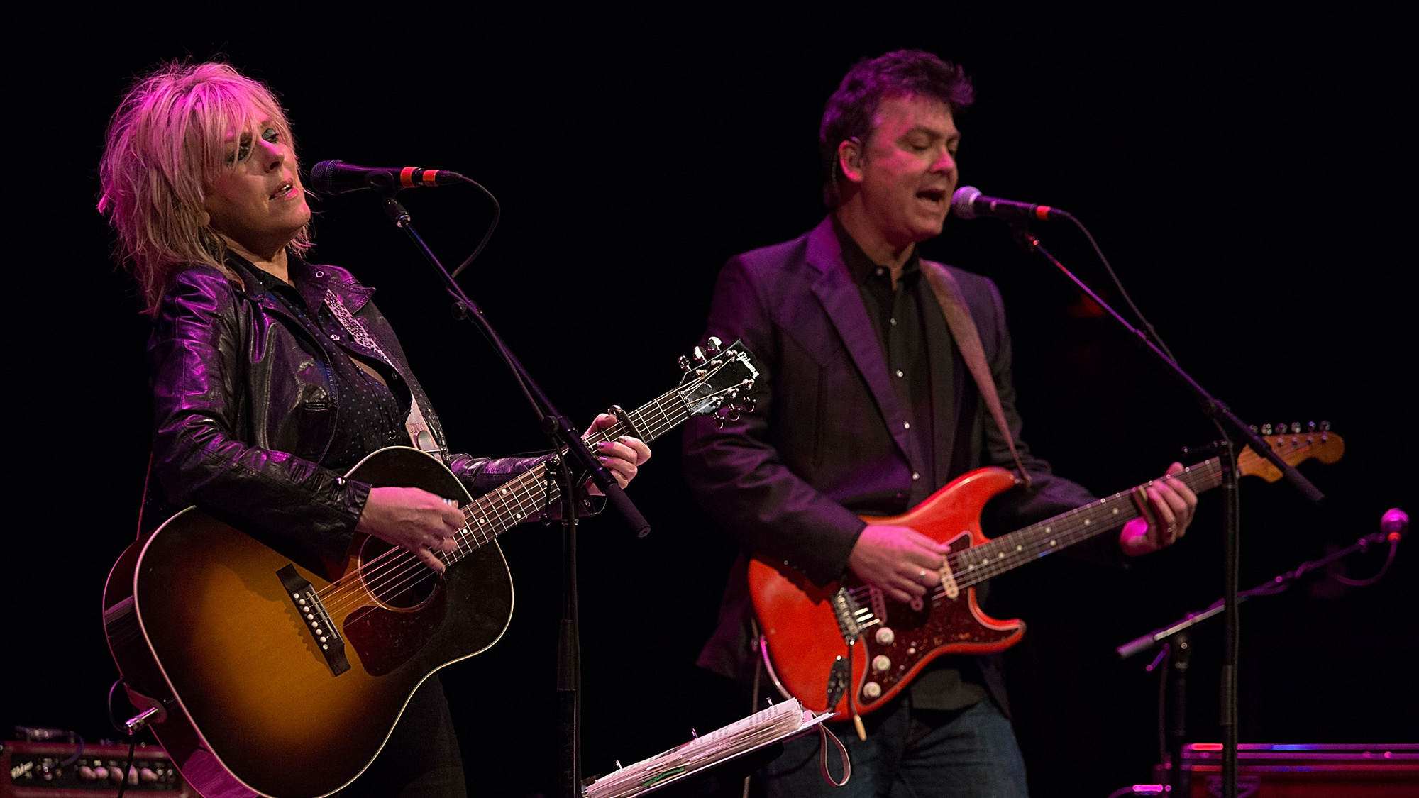 Musicians Lucinda Williams and Doug Pettibone perform in concert at The Paramount Theatre on January 16, 2013 in Austin, Texas