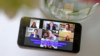 A smartphone showing a video call which Princess Anne and Queen Elizabeth II participated in