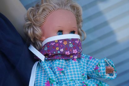 Doll with face mask