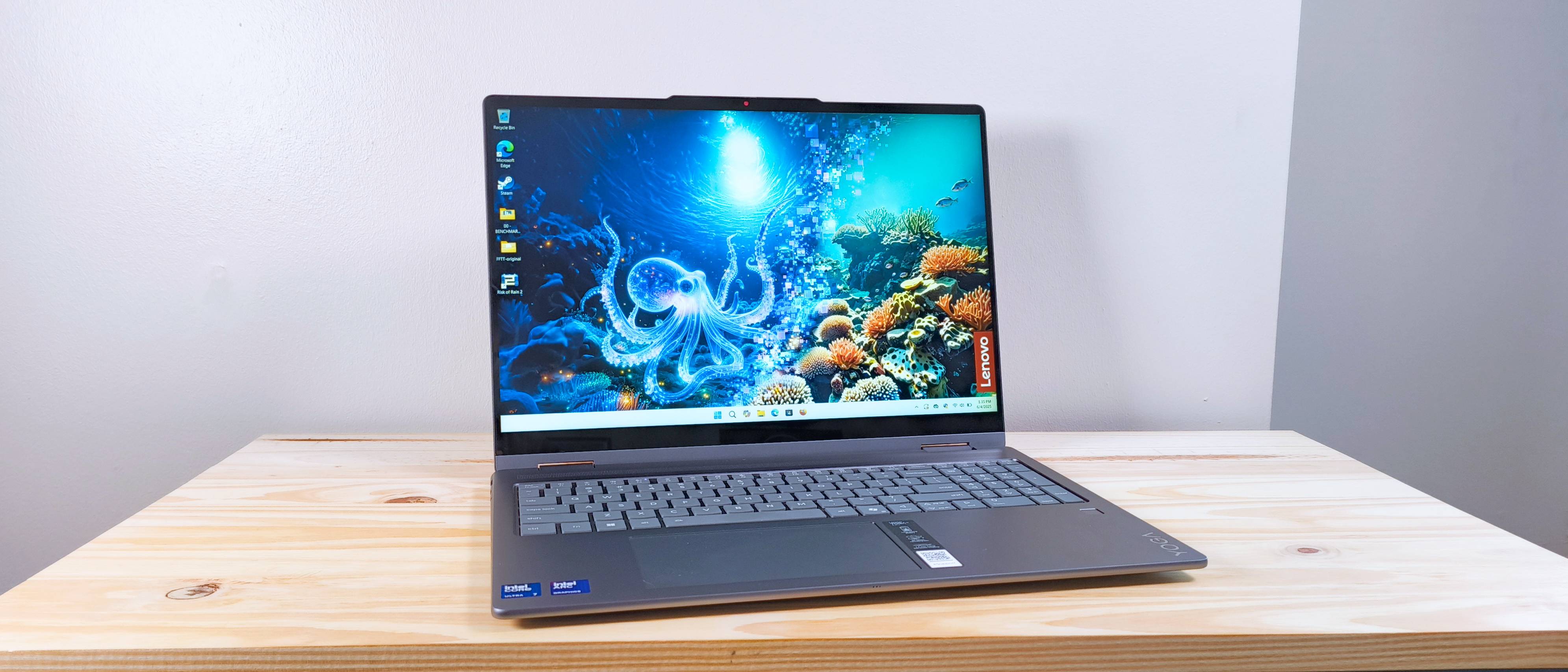 The Lenovo Yoga 7i 2-in-1 16 on a wood table