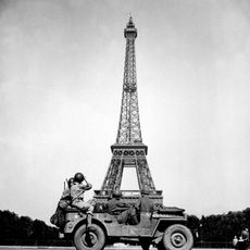 the 4th U.S. Infantry Division look at the Eiffel Tower