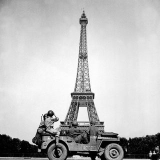 the 4th U.S. Infantry Division look at the Eiffel Tower