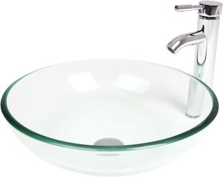 Round glass vessel sink with chrome tap