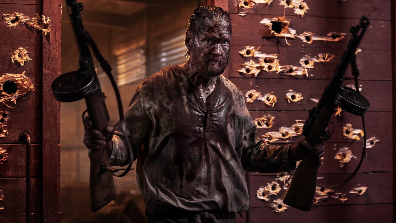 Aatami Korpi (Jorma Tommila) wields guns in Sisu: Road to Revenge.