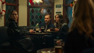 Dove (Siobhán Cullen), Gilbert (Will Forte) and Emmy (Robyn Cara) sitting in a pub in Bodkin episode 1