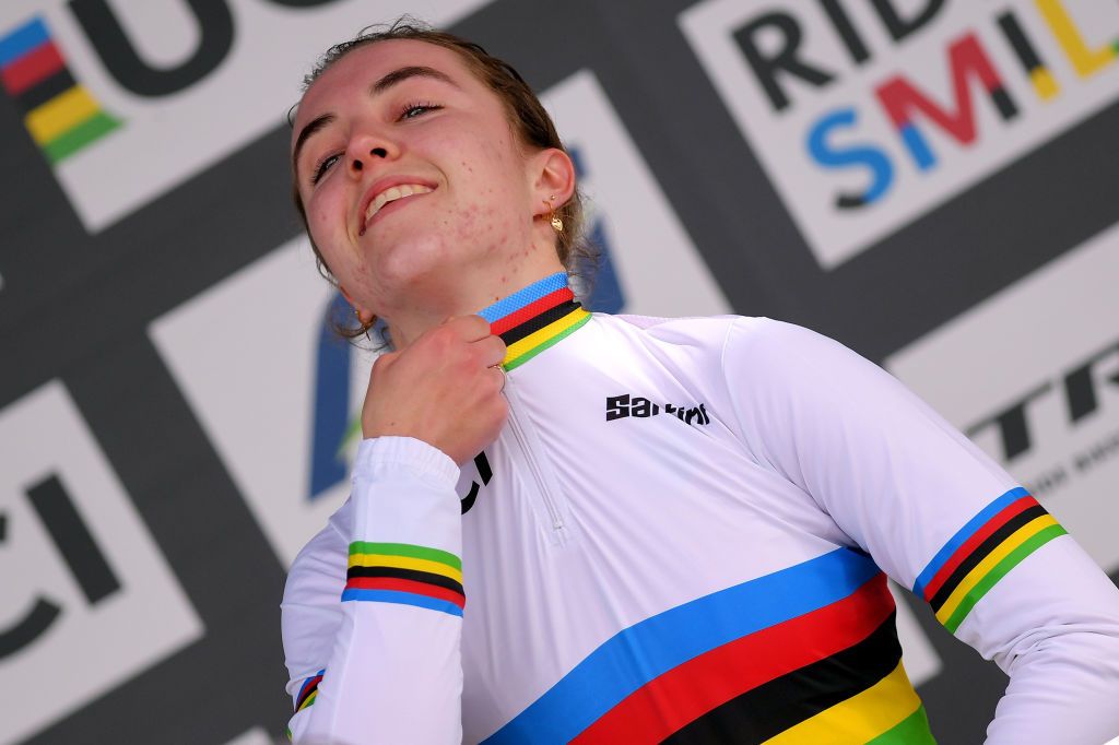 Van Rooij pulls on the rainbow jersey