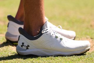 A close up of Jordan Spieth's white Under Armour shoes