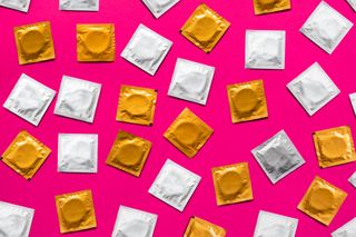 Male contraceptive: Condoms on a pink background