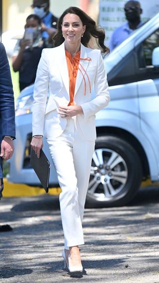 Kate debuted the white Alexander McQueen pantsuit in 2022, during her visit to Jamaica