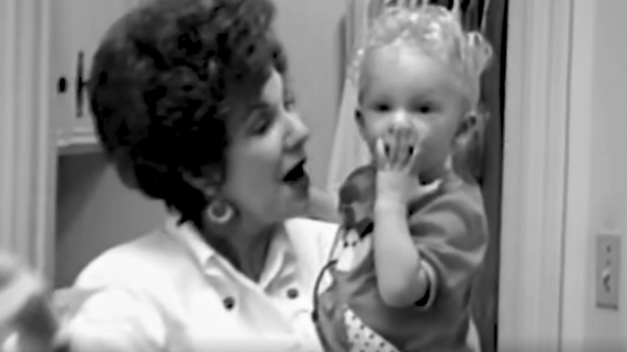 Marjorie Finlay holding a baby Taylor Swift in footage from the "Marjorie" lyric video