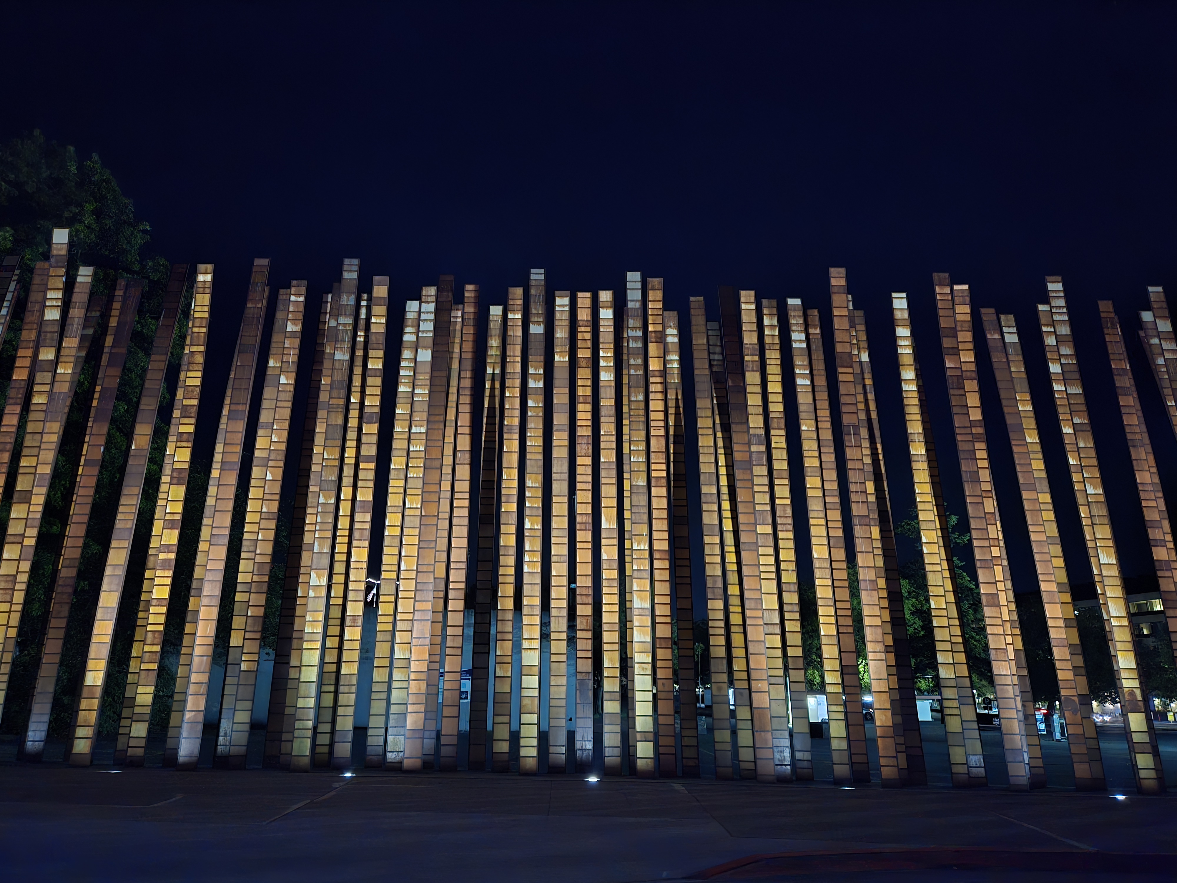 Tall pillars lit up at night