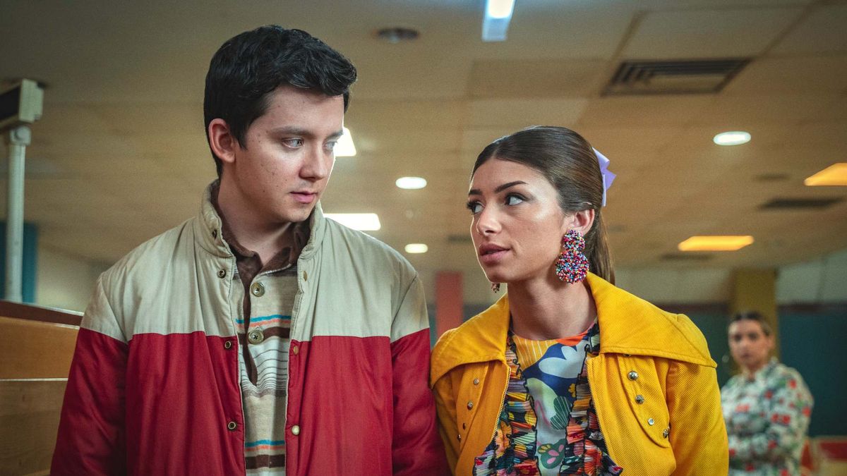  Asa Butterfield as Otis Milburn looks at Mimi Keene as Ruby Matthews in Sex Education on Netflix