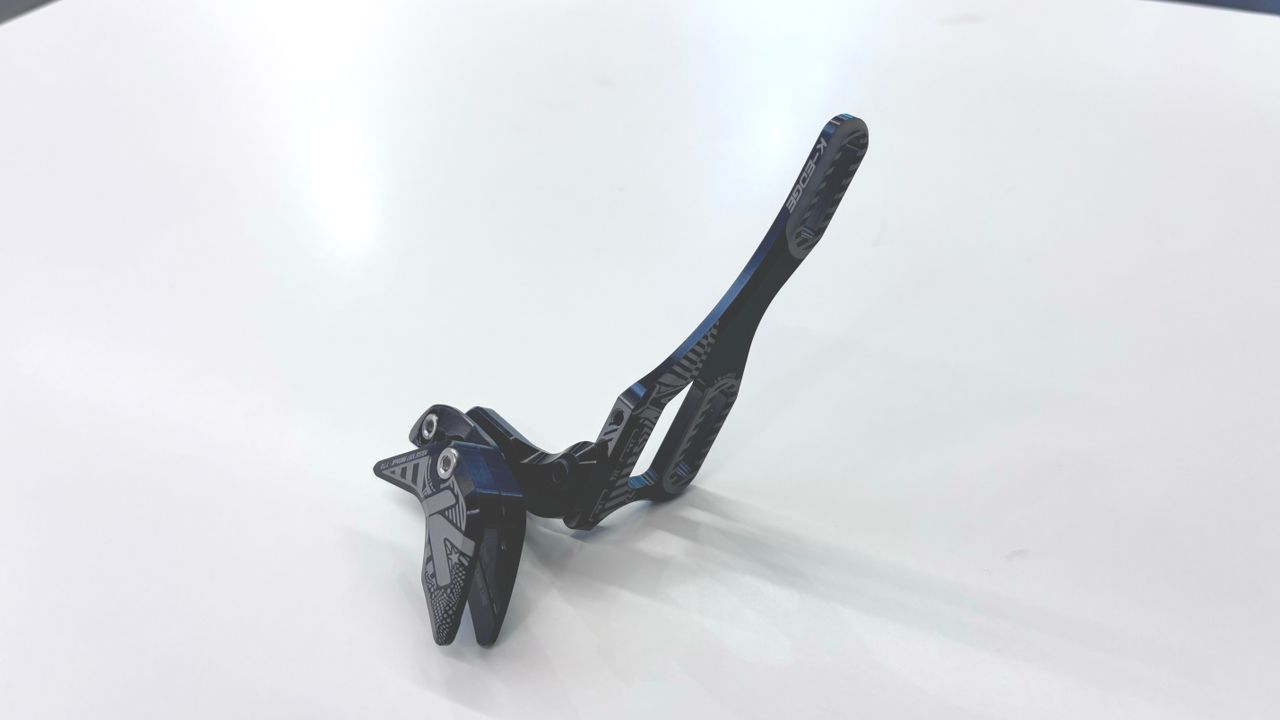 Close up of a K-Edge bottle-cage-mounted chain guide