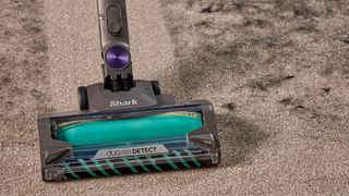 Shark PowerDetect cordless vacuum clearing dog hair from a carpet