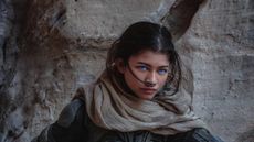 Zendaya as Chani in Dune standing near a wall with blue eyes