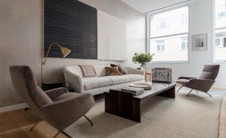 white room with sofa set and a table