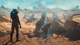 A character from the Outer Worlds 2 trailer scratches their own head, as their silhouetted design hasn't been designed on by the developers yet. The chasm looks pretty, though.