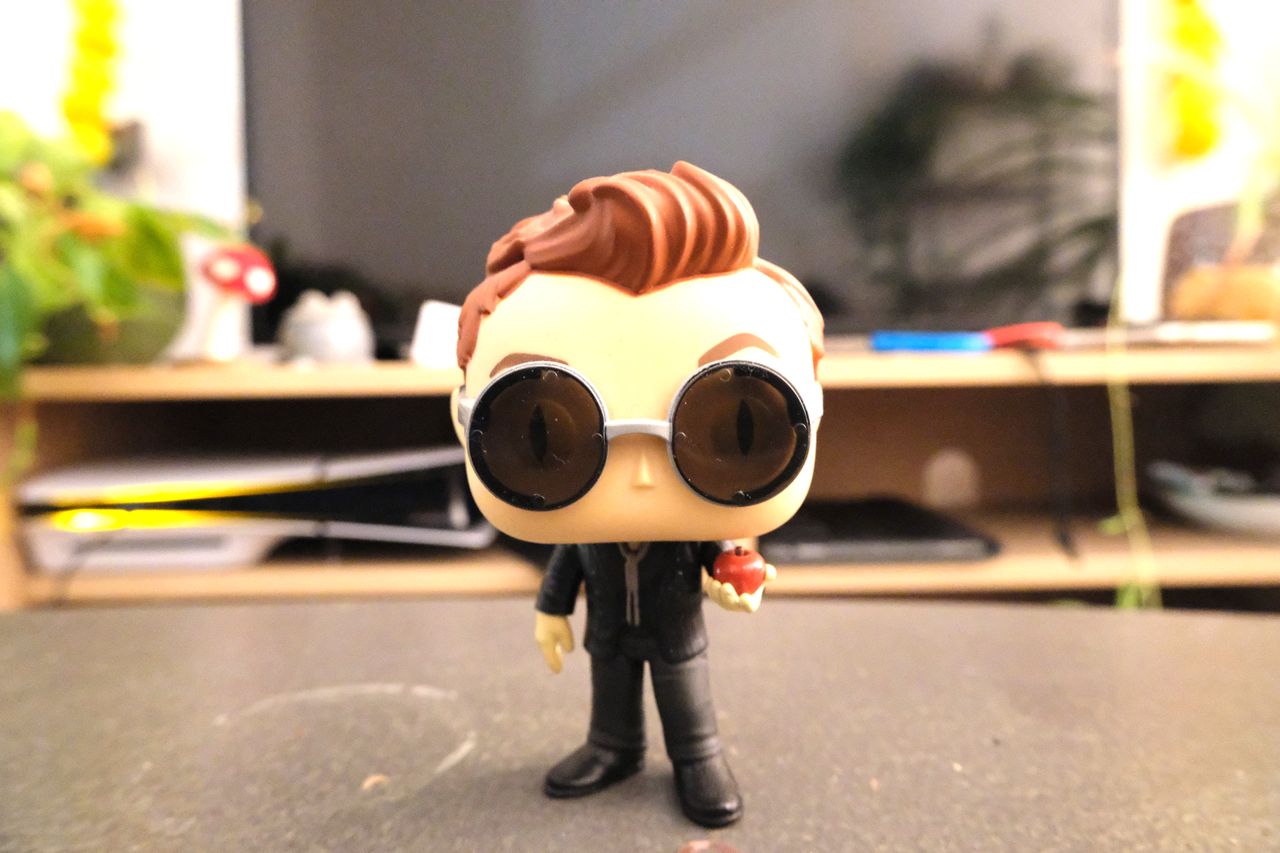 A Funko Pop figure of Crowley from Good Omens, taken on a Fujifilm X-M5 mirrorless vlogging camera