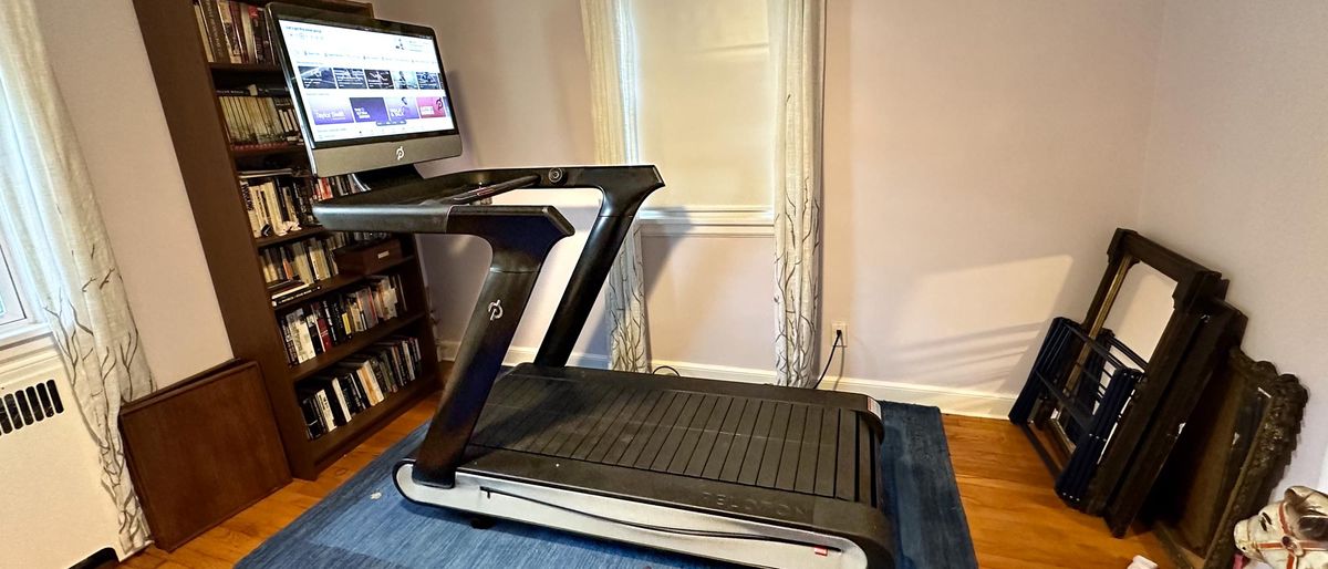 Peloton Tread+ in a person&#039;s home office with the display on